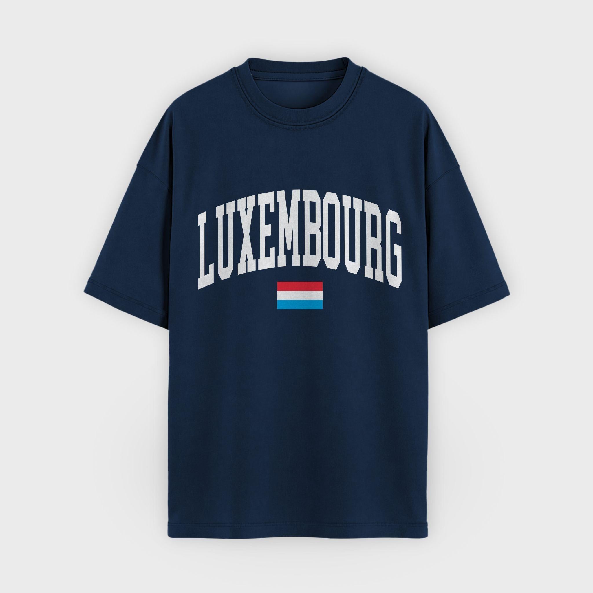 Minimalist navy unisex t-shirt featuring arched white "LUXEMBOURG" collegiate typography and a small flag icon, part of the Layover Collective modern souvenir collection.